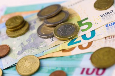 Euro money bills and coins close up. Big amount of euro money on table. Business and budget concept