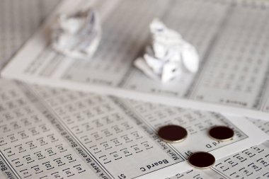 Crumpled lottery tickets as symbol of losing the lottery game. Unlucky gambling results. Misfortune and money spending
