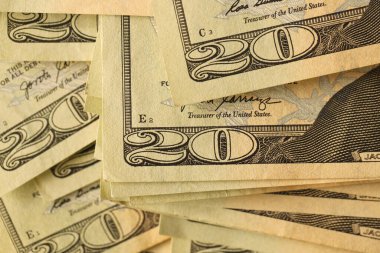 Big amount of old 20 dollar bills details on macro photography. Money earnings, payday or tax paying period concept