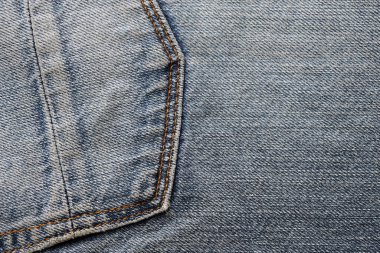 Koyu mavi kot kumaşın detaylı soyut dokusu. Eski kullanılmış kot pantolon kumaşının arkaplan resmi