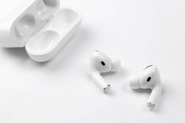 KHARKIV, UKRAINE - JANUARY 27, 2021: Apple AirPods Pro on a white background. Wireless headphones. Apple Inc. is an American technology company headquartered in California