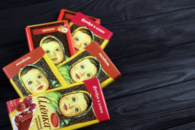 KHARKIV, UKRAINE - JANUARY 27, 2021: Alyonka chocolate square bars - product from Red October chocolate factory. Old russian traditional chocolate design