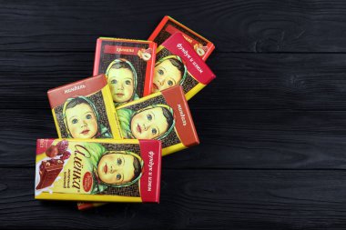 KHARKIV, UKRAINE - JANUARY 27, 2021: Alyonka chocolate square bars - product from Red October chocolate factory. Old russian traditional chocolate design