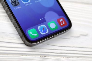 KHARKIV, UKRAINE - JANUARY 27, 2021: Apple Iphone 12 pro new brand model smartphone with IOS base on white background. Apple Inc. is an American technology company headquartered in California