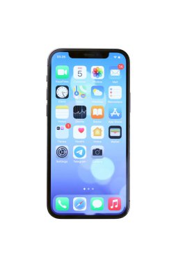 KHARKIV, UKRAINE - JANUARY 27, 2021: Apple Iphone 12 pro new brand model smartphone with IOS base on white background. Apple Inc. is an American technology company headquartered in California