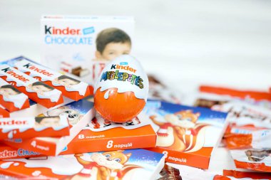 KHARKIV, UKRAINE - FEBRUARY 14, 2021: Kinder Chocolate various production. Kinder is a confectionery product brand line of Italian multinational confectionery Ferrero.
