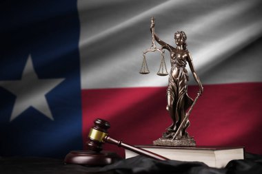 Texas US state flag with statue of lady justice, constitution and judge hammer on black drapery. Concept of judgement and punishment clipart