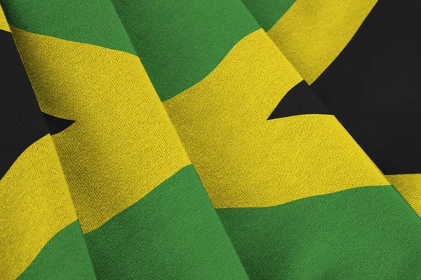 Bandiera Giamaicana Con Grandi Pieghe Che Sventolano Vicino Sotto Luce — Foto Stock
