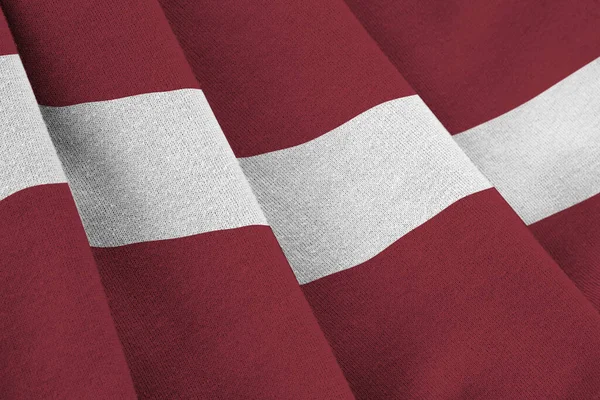 Łotwa Flaga Dużymi Fałdami Macha Bliska Pod Światło Studio Wewnątrz — Zdjęcie stockowe
