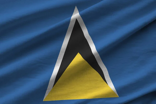 Flaga Saint Lucia Dużymi Fałdami Machająca Bliska Pod Światłem Studyjnym — Zdjęcie stockowe