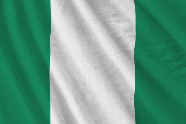 Bandeira Nigéria Com Grandes Dobras Acenando Perto Sob Luz Estúdio — Fotografia de Stock