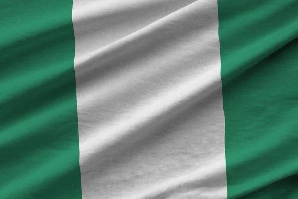 Bandeira Nigéria Com Grandes Dobras Acenando Perto Sob Luz Estúdio — Fotografia de Stock