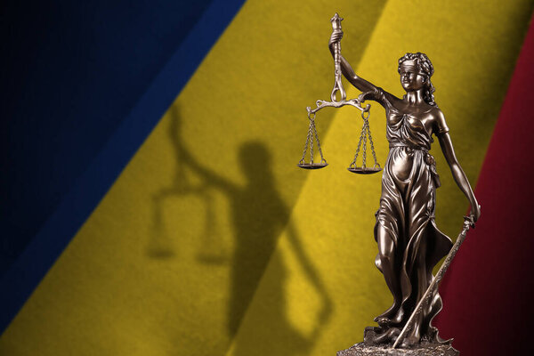 Romania flag with statue of lady justice and judicial scales in dark room. Concept of judgement and punishment, background for jury topics