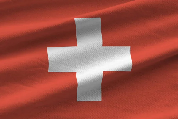 Прапор Швейцарії Великими Складками Махають Під Освітленням Студії Офіційні Символи — стокове фото
