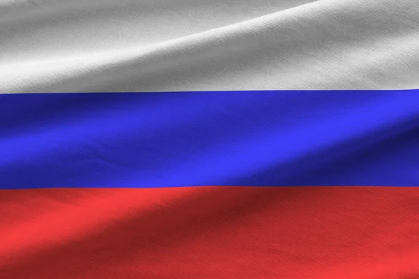 スタジオの光の下で屋内で近くに手を振って大きな折り目を持つロシアの旗 ファブリックバナーの公式シンボルと色 — ストック写真