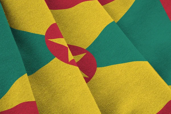 Bandiera Grenada Con Grandi Pieghe Sventolando Vicino Sotto Luce Dello — Foto Stock