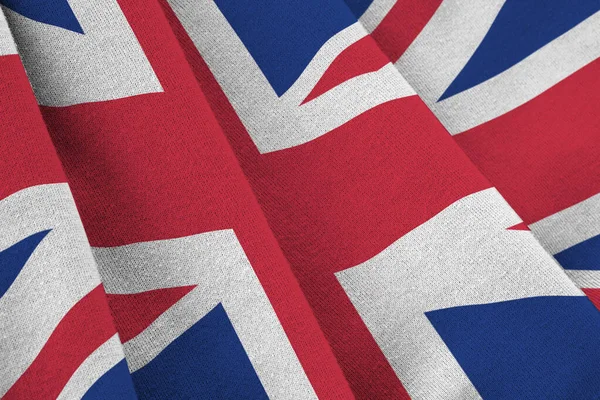 Stor Brittisk Flagga Med Stora Veck Viftar Nära Håll Studioljuset — Stockfoto
