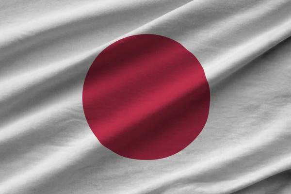 일본은 아래에서 접히고 흔들며 깃발을 그린다 천으로만든 상징물 — 스톡 사진