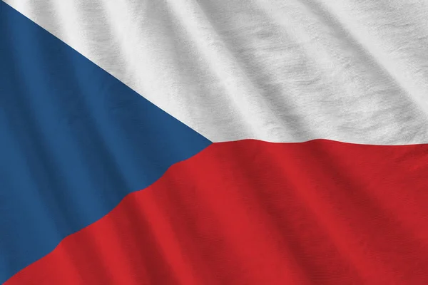 Czech flag with big folds waving close up under the studio light indoors. The official symbols and colors in fabric banner