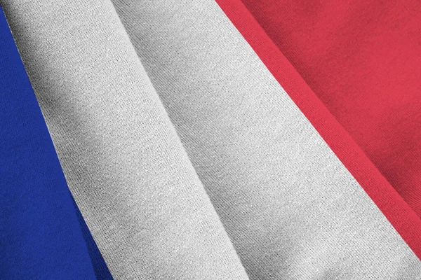 法国国旗 巨大的褶皱在室内的灯光下摇曳着 织物横幅中的官方符号和颜色 — 图库照片