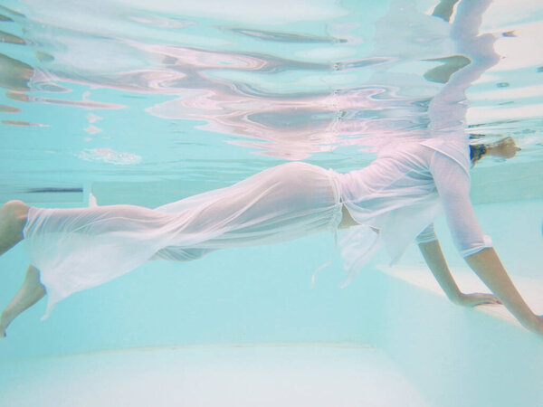 Pool-woman body  relaxing underwater