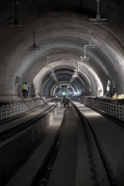 Underground facility with a big tunnel leading deep down. Metro - subway construction site. High quality photo