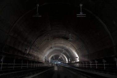 Underground facility with a big tunnel leading deep down. Metro - subway construction site. High quality photo