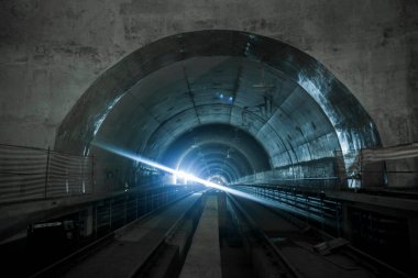Underground facility with a big tunnel leading deep down. Metro - subway construction site. High quality photo
