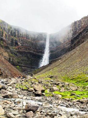 The Waterfall and basaltic rocks at the Litlanesfoss Valley in Iceland
