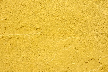 Beton duvar tekrar tekrar boyanmış, sonuncusu sarıya boyanmış. Vektör boya dokusu arkaplanı