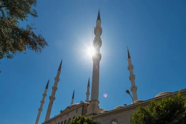 Minarets of the Muslim mosque of Mersin built with Ottoman architecture seen against the light and contrapicado