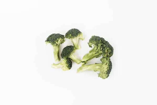 Beberapa Ranting Brokoli Hijau Kecil Dengan Batang Mentah Pada Latar — Stok Foto