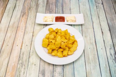 Typical Madrid tapa of patatas bravas with spicy sauce