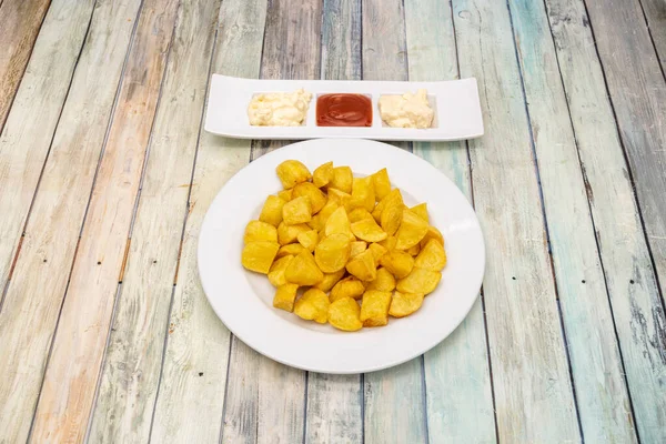 Typical Madrid tapa of patatas bravas with spicy sauce
