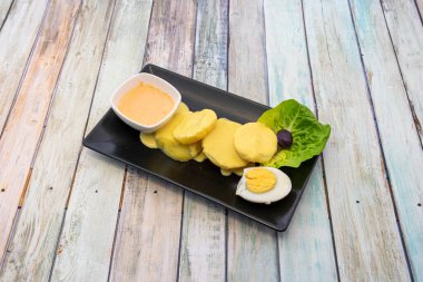 Lezzetli Papa a la Huancaina 'nın eşsiz kremi gibi Peru gastronomisini daha iyi temsil eden bir yemek yoktur.