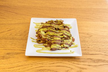 Venezuela 'da mangal kömür ya da yakacak odunla pişirilen bir yemektir. Çoğunlukla bol miktarda sığır eti, tavuk, sucuk, kara puding, pirzola ya da domuz pirzolası içerir.