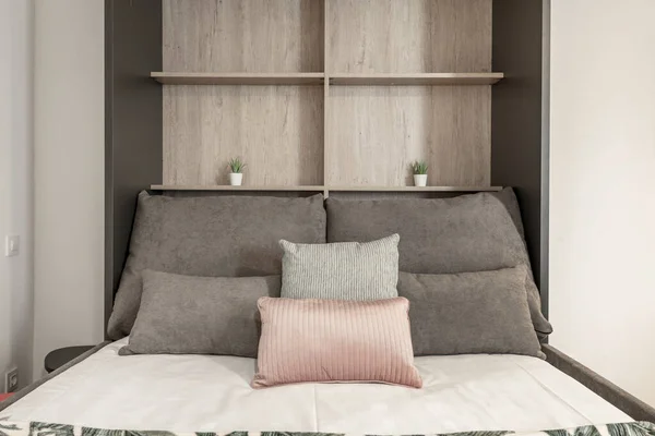 Folding Bed Cushions Various Sizes Colors White Bedding Wooden Shelves — 스톡 사진