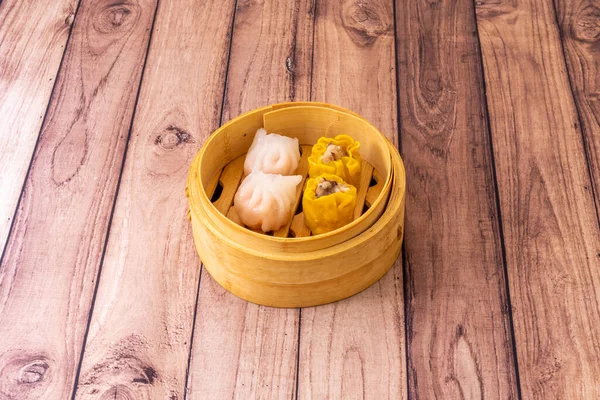 Dim sum is a Cantonese term that can be translated as order to the heart\'s content the idea of a wide variety of small plates for lunch is also used in other parts of China