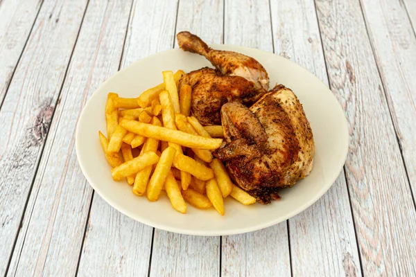 Half Roasted Chicken French Fries White Plate Wooden Table — Fotografia de Stock