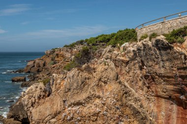 Viewpoint with brownstone cliffs on the Portuguese Atlantic coast on a summer day