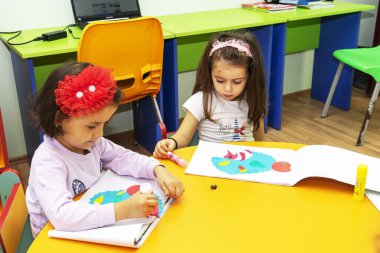 BAKU,AZERBAIJAN-25 MAY 2019 : Children are engaged in the classroom, kindergarten learning, drawing
