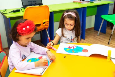 BAKU,AZERBAIJAN-25 MAY 2019 : Children are engaged in the classroom, kindergarten learning, drawing