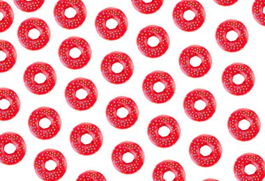 Beyaz pastel arka planda pembe kaplı çörek deseni. Yaratıcı kavram