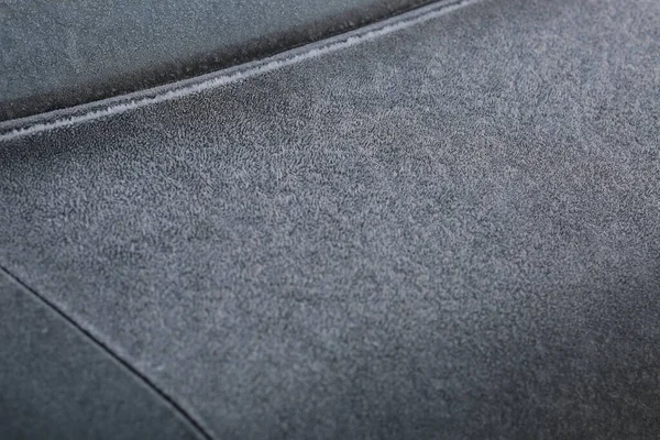The rear tinted glass of the car and the trunk lid in dark green 