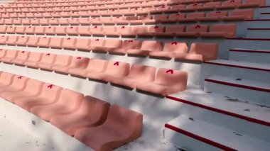 Outdoor theater. Rows of seats on a sunny day with seat tags for coronavirus precautions