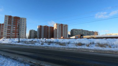 Russian brick residential buildings. Cold snowy winter and panorama of Russian buildings