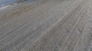 Winter road, tire tread marks and a lot of snow on the road