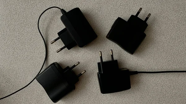 Different Types Chargers Electrical Devices Black Wires Connectors Battery Packs — Stock Photo, Image