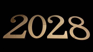 Siyah arkaplandaki altın sayılar tarihi sembolize eder veya bir şey belirtir