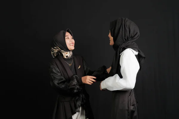 Two Happy Young Asian Muslim Women Interact Isolated Black Background — Stock Photo, Image